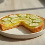 air fryer lime bars tangy: Close-up of golden crust and tangy lime layer in air fryer lime bars, dusted with sugar.