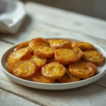 air fryer bread and butter pickles: Golden crispy air fryer bread and butter pickles with glazed edges on a plate
