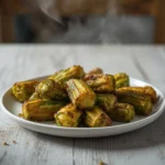 air fryer okra crispy: Golden crispy air fryer okra with crunchy edges in a bowl