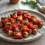 air fryer veggie kabobs: Golden brown air fryer veggie kabobs on a skewer with charred edges and bright colors.