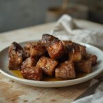 Air Fryer Beef Tips: Juicy air fryer beef tips with golden crisp edges on a rustic plate.