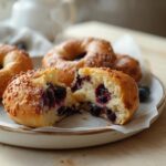 Air Fryer Blueberry Bagels: Golden Air Fryer Blueberry Bagels with crispy edges and juicy blueberries on a rustic board