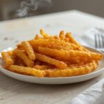 Air Fryer Crispy Waffle Fries: Golden crispy air fryer waffle fries with crisp edges on a plate for breakfast brunch.