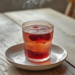 Air Fryer Summer Mocktails: Frosted glassware filled with ruby-red berries and bubbly sparkling water, perfect for summer mocktails.