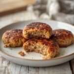 Air Fryer Turkey Sausage Patties: Golden brown air fryer turkey sausage patties with crispy edges on a plate.